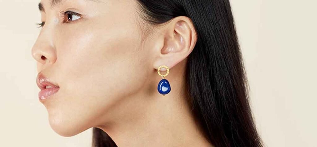 Woman wearing lapis lazuli earring