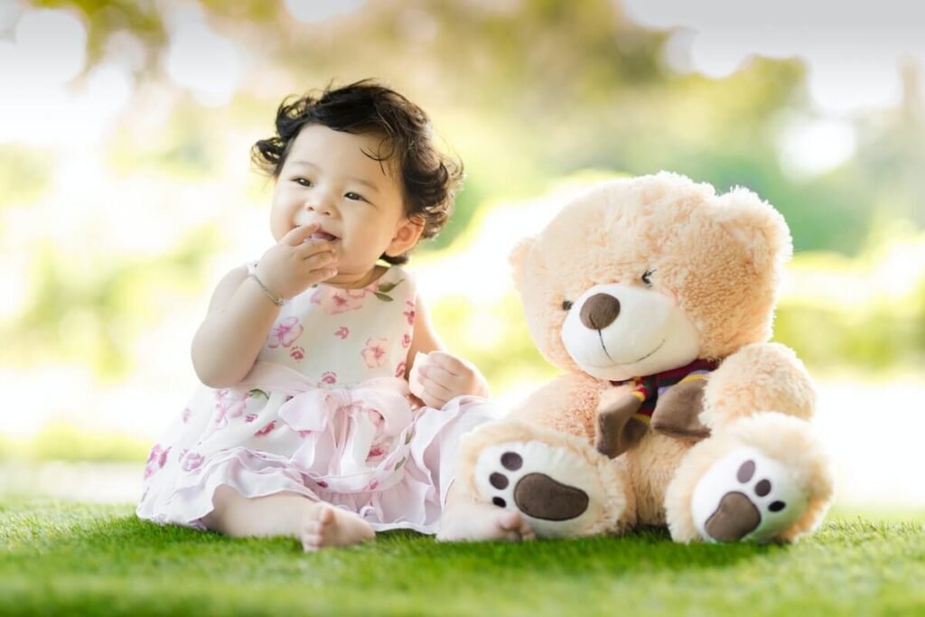 toddler putting hand in mouth