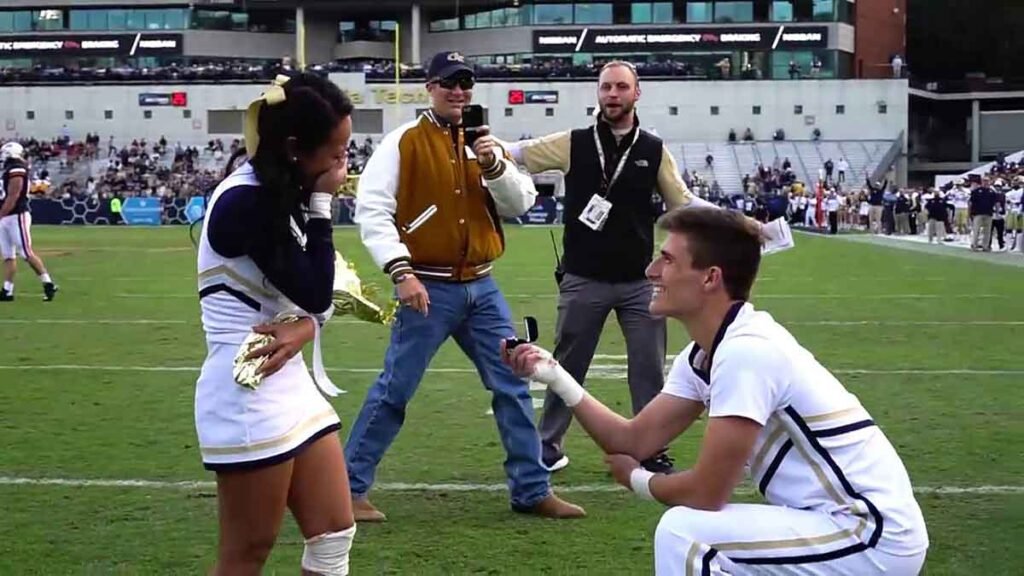 Marriage proposal on a football field