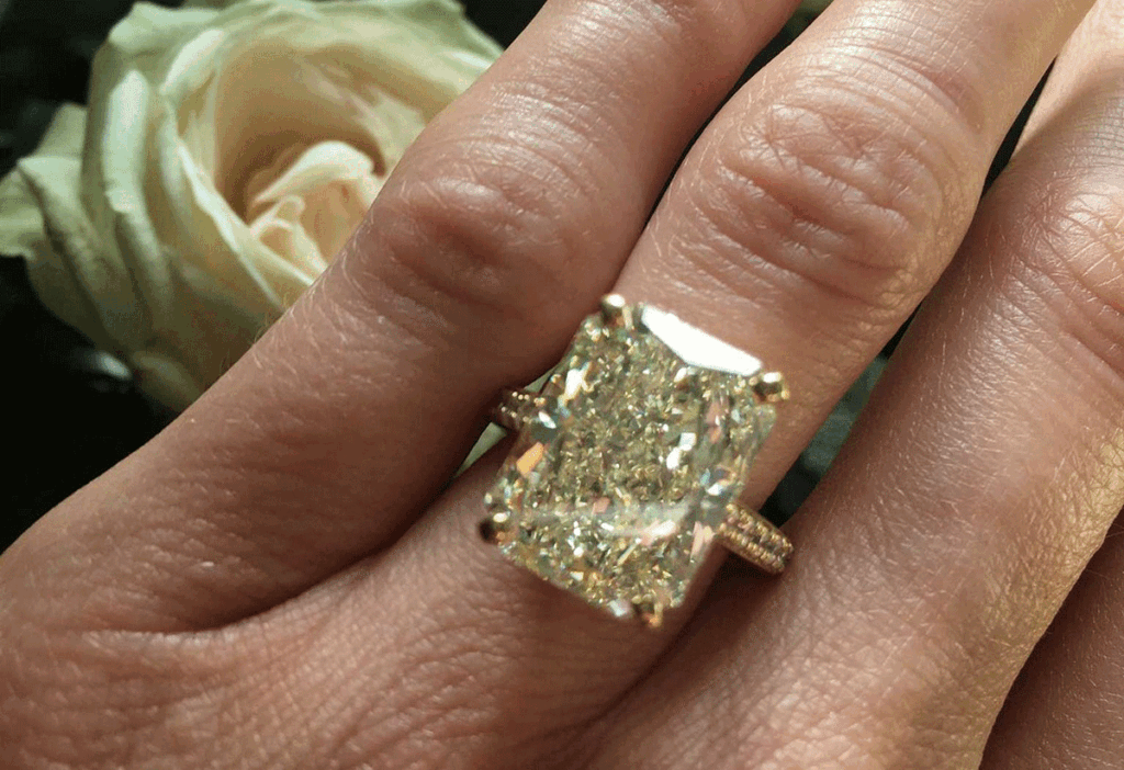 Radiant cut fancy yellow diamond engagement ring