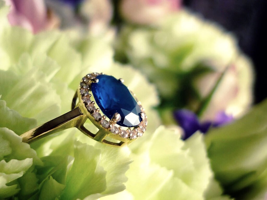 engagement ring with a blue gemstone