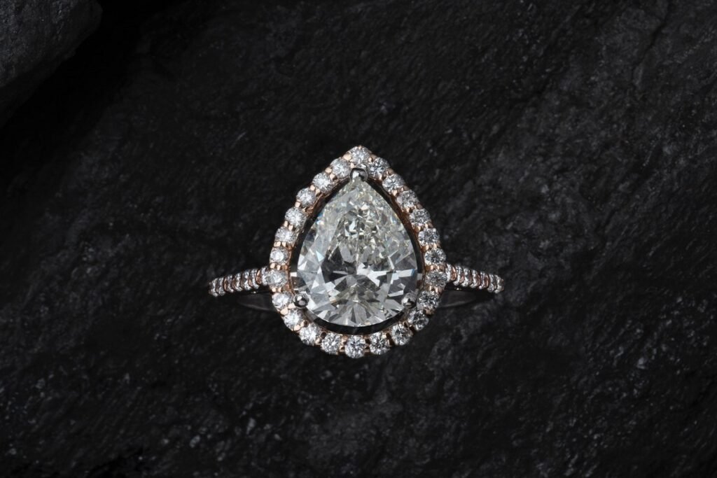 pear-shaped diamond ring on halo and pave setting