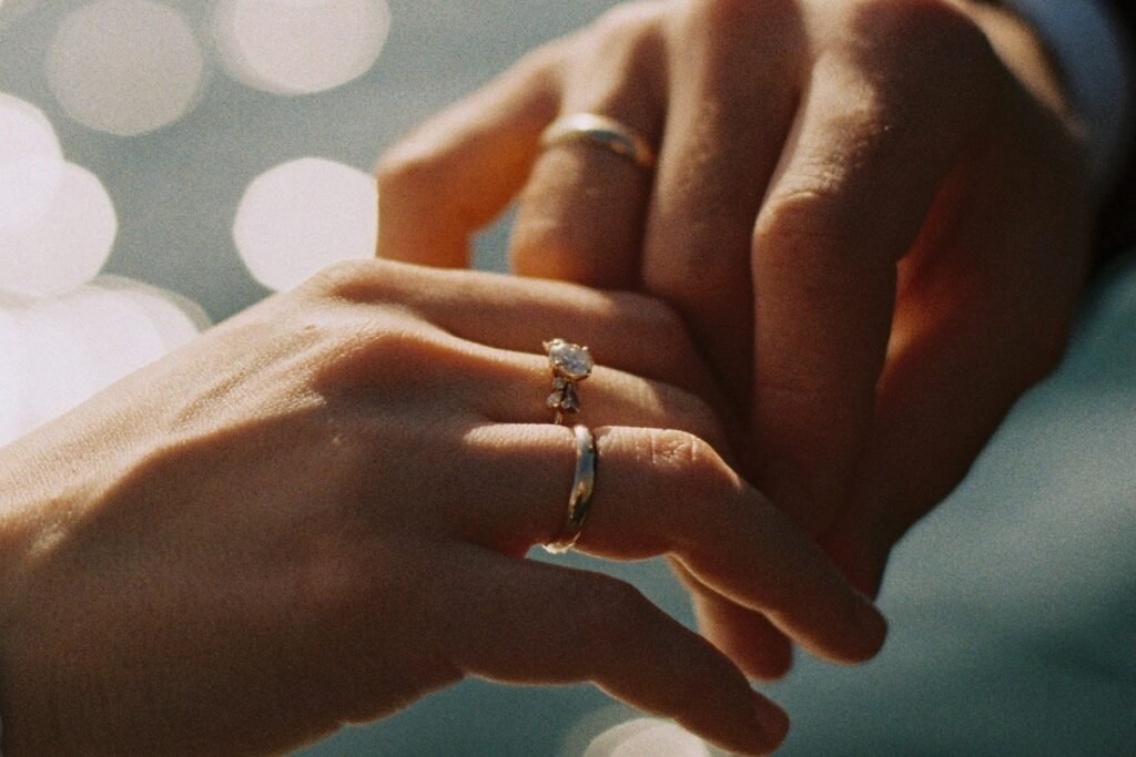 diamond rings on a couple's fingers