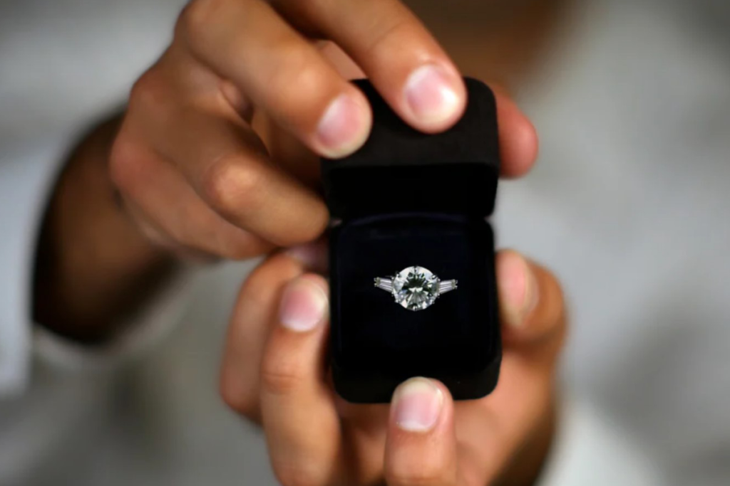 A man presenting his engagement ring