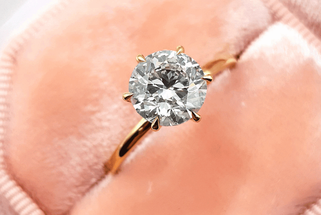 Yellow gold solitaire engagement ring