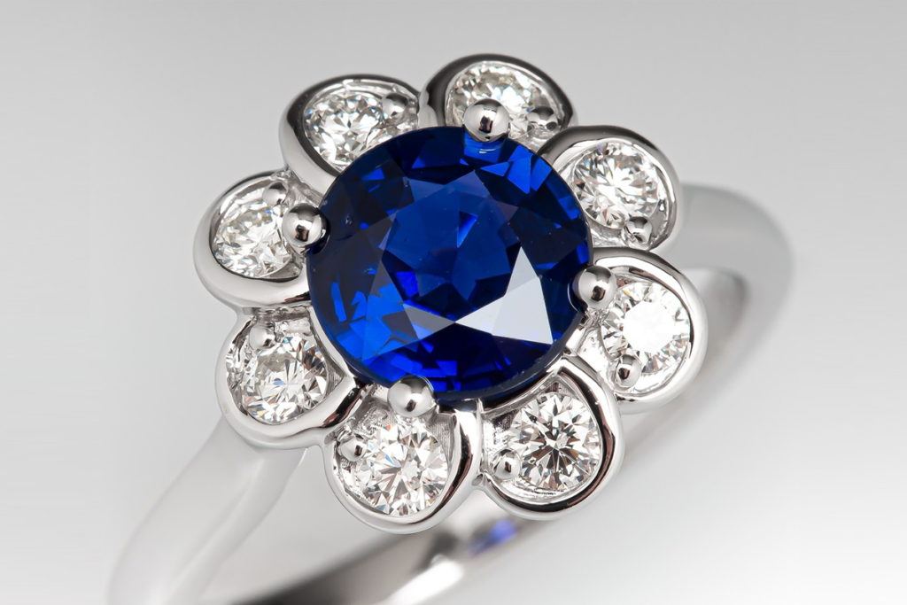 Blue sapphire diamond flower engagement ring