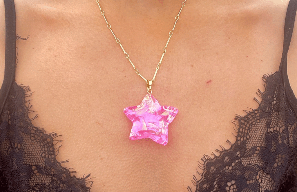 woman wearing a rose aura pendant