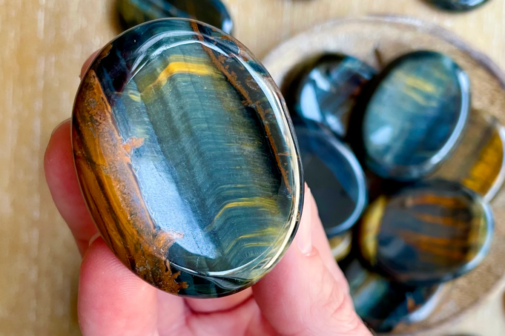 Several blue tigers eye worry stones
